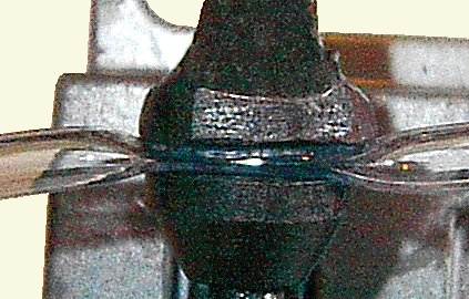 pipe pinched in the jaws of a 'G' clamp