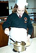 Belinda Clarke Adding the crushed biscuits and mixing all together